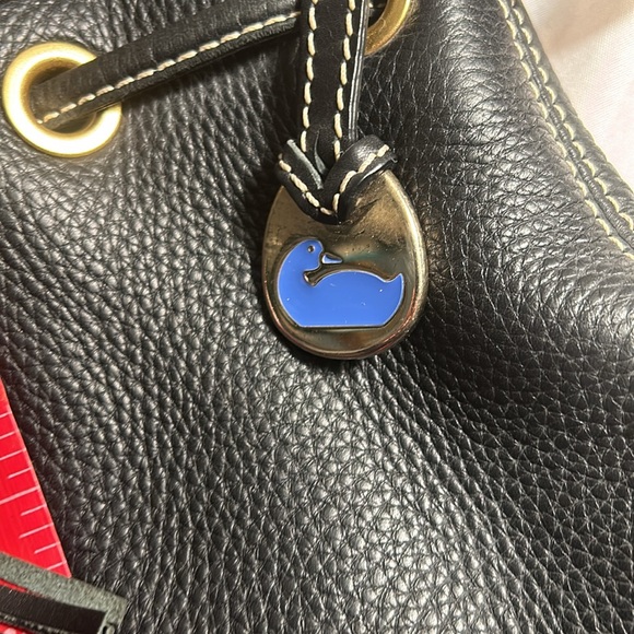 Dooney & Bourke Drawstring bag with tassels and duck tag. - Picture 8 of 12